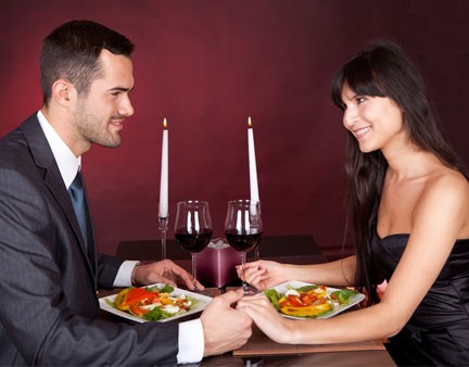 happy couple in restaurant having dinner
