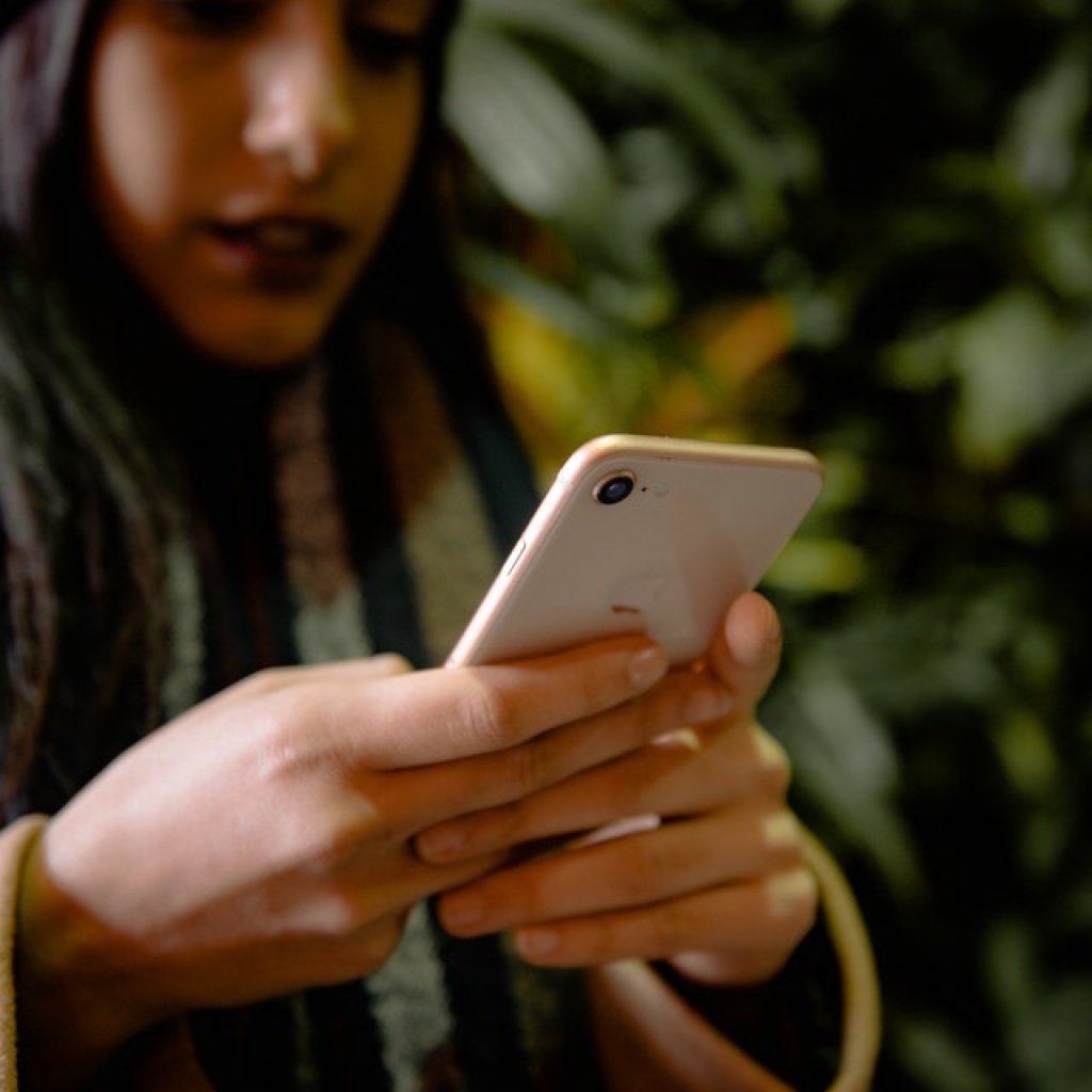 Woman holding smart phone