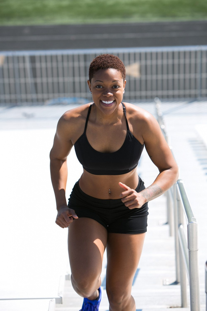 Woman running up stairs for exercise and to maintain a healthy weight