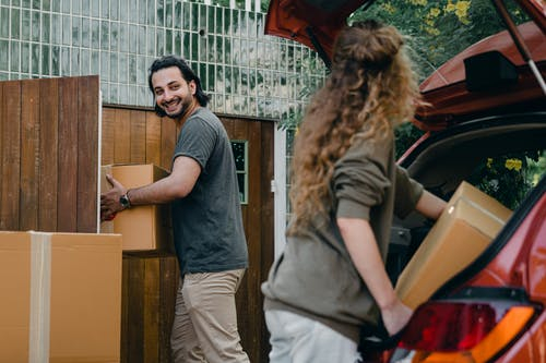 woman and man with moving boxes