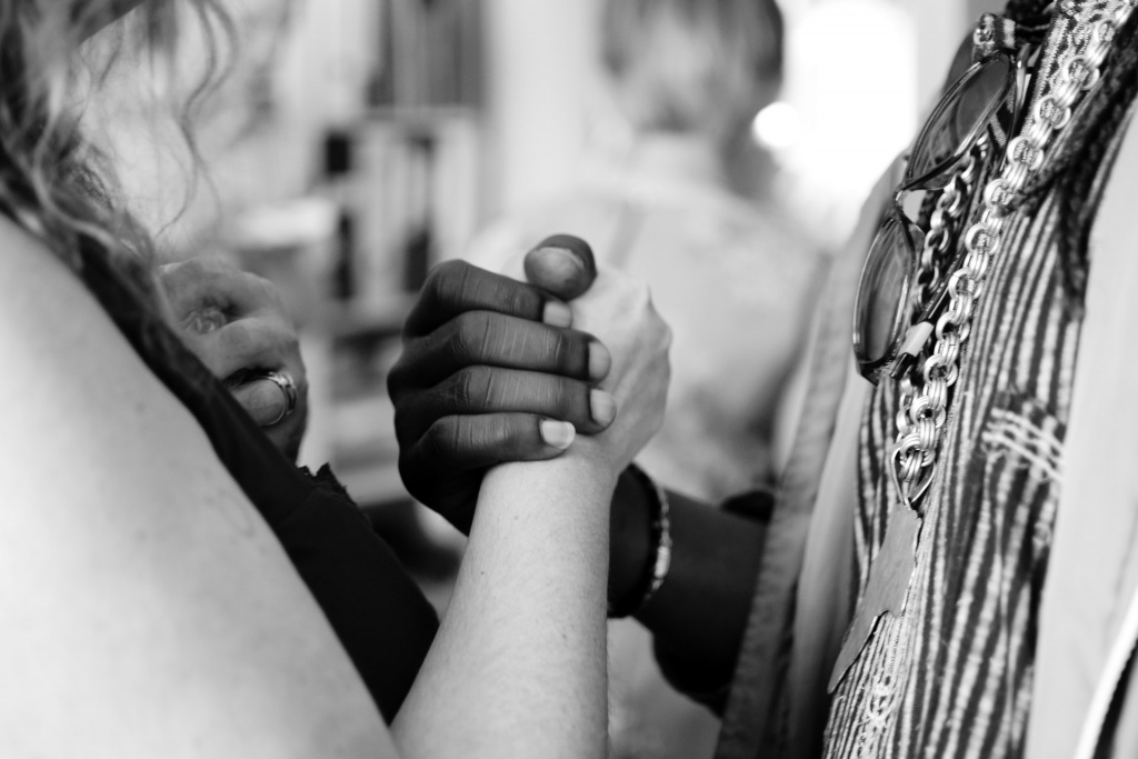 A white woman and black man holding hands