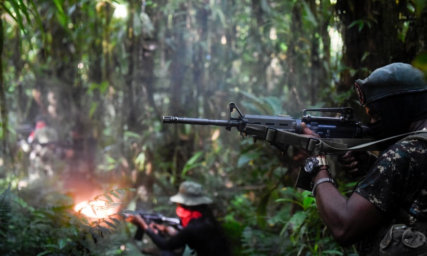 Soldiers shooting in a forest