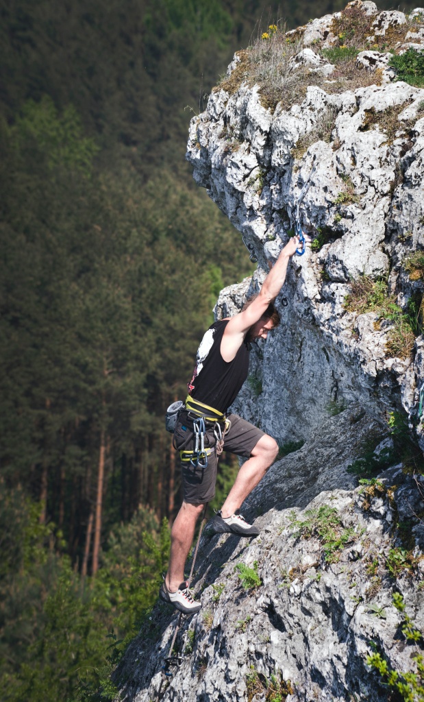 A guy climbing a mountain