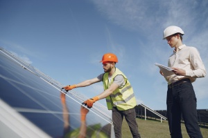 A man installing solar panels