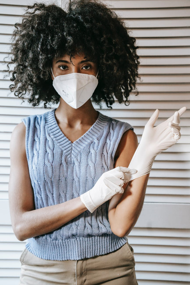 Woman wearing face mask and gloves