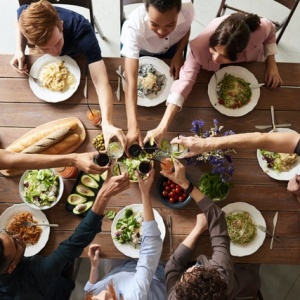 family and friends eating a healthy dinner